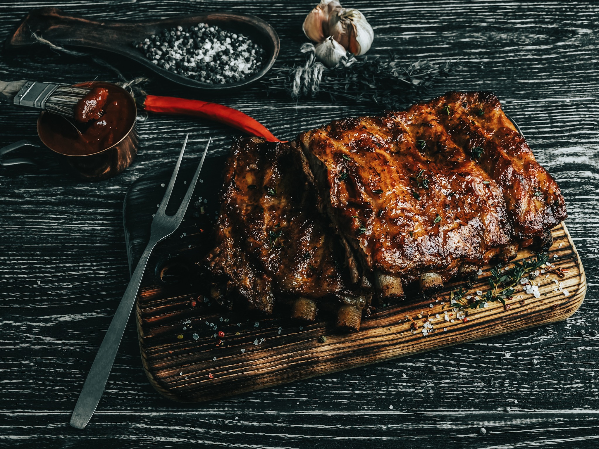 grilled pork ribs with sauce on a cutting board , spice, marinade